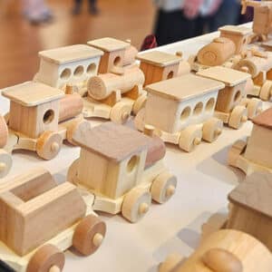 A closeup of wooden trains built with purpose by the residents of Reata Glen 